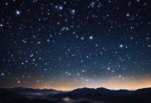 Star-filled night sky over silhouetted mountains with a faint, early dawn light on the horizon, reminiscent of dream interpretations where dreaming about stars often signifies hope and endless possibilities.